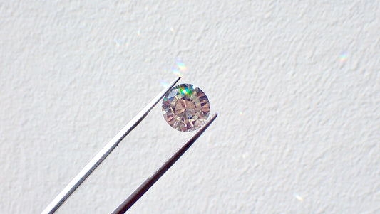 A lab-grown diamond being examined by a jeweller.